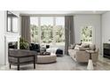 Bright living room with large windows, comfortable seating, and elegant decor at 7310 Raybourn Ct, Indianapolis, IN 46259