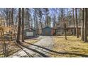 View of home's front exterior and driveway, plus a detached garage with basketball hoop at 8172 S Shoreview Dr, Trafalgar, IN 46181