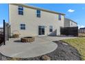 Spacious backyard featuring a stone fire pit and a well-manicured lawn at 8523 Hulton Rd, Pendleton, IN 46064