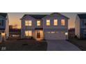 Charming two-story home with an attached two-car garage during sunset at 8523 Hulton Rd, Pendleton, IN 46064