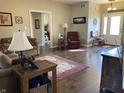 Inviting living room with hardwood floors, comfortable seating, and a view of the front entrance at 1002 Plummer Rd, Martinsville, IN 46151