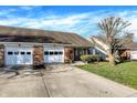The property has a brick facade, well-manicured lawn, and an inviting walkway leading to the entrance at 1035 Ina Cir, Franklin, IN 46131