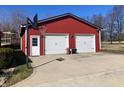 Detached garage with two garage doors and a basketball hoop on the side of the garage at 10476 N Prairie Hills Dr, Mooresville, IN 46158