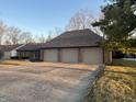 Attached three-car garage with paved driveway for convenient parking and easy access to the home at 10610 Stormhaven Way, Indianapolis, IN 46256