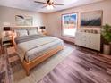 Cozy bedroom with a stylish wooden bed frame and modern decor with ample natural light at 1195 Chad Ct, Plainfield, IN 46168