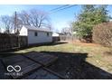 Fenced backyard featuring a small wood deck, offering privacy and space for outdoor seating and entertainment at 1334 Hannibal St, Noblesville, IN 46060