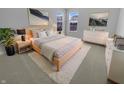 Serene bedroom with soft carpet, light wood furniture, and bright light, creating a peaceful retreat at 15704 Millwood Dr, Noblesville, IN 46060
