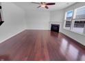 Bright living room with hardwood floors, modern fireplace, and abundant natural light, ideal for entertaining at 15704 Millwood Dr, Noblesville, IN 46060