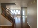 Inviting entryway with hardwood floors and a staircase leading to the upper level at 1735 Sonesta Ln, Indianapolis, IN 46217