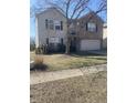 Charming two-story home featuring brick and siding, with a well-maintained lawn and mature landscaping at 1735 Sonesta Ln, Indianapolis, IN 46217