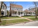 View of home's exterior showing the well-maintained lawn and neighborhood at 2299 Glebe St, Carmel, IN 46032