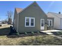 Charming home features meticulous landscaping, covered porch, and a well-maintained exterior at 2341 California St, Columbus, IN 47201