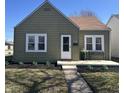 Charming home features meticulous landscaping, covered porch, and a well-maintained exterior at 2341 California St, Columbus, IN 47201