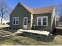 Charming home features meticulous landscaping, covered porch, and a well-maintained exterior at 2341 California St, Columbus, IN 47201