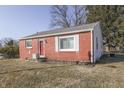 A cozy house showcasing a well-maintained lawn and a mix of brick and siding at 3044 S Keystone Ave, Indianapolis, IN 46237