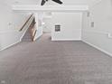 Spacious carpeted living room with white walls and trim, offering a blank canvas with plenty of natural light at 3153 Underwood Dr, Whiteland, IN 46184
