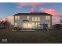 Spacious backyard with patio, outdoor seating, and a playset perfect for Gathering gatherings at 348 Entrance Hall, Greenwood, IN 46142