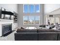 Bright living room with large windows, fireplace, and comfortable seating, perfect for relaxing at 348 Entrance Hall, Greenwood, IN 46142