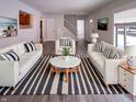 Bright living room boasting neutral walls, modern furnishings, and a large window at 3743 Celtic Dr, Indianapolis, IN 46235