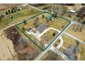 Expansive aerial view of a meticulously landscaped property with a sprawling lawn at 3949 W 250 N, Anderson, IN 46011