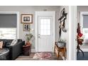 Cozy entryway with a white door, stylish decor, and modern accents to welcome guests at 4429 Crittenden Ave, Indianapolis, IN 46205
