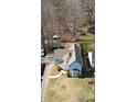 Birds eye view of home on a large lot, featuring mature trees and a long private drive at 5014 Melbourne Rd, Indianapolis, IN 46228