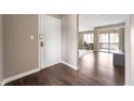 Entryway with wood floors leading to a living area and sliding glass doors at 505 W Hunters Dr # D, Carmel, IN 46032