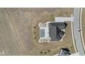Expansive aerial view of a backyard featuring a pool, patio, and firepit, ideal for outdoor living at 5189 Abbeygate Blvd, Bargersville, IN 46106