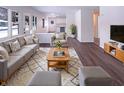 Bright living room showcasing stylish furniture, hardwood floors, and seamless open-concept design at 639 S Alpha Ave, Brownsburg, IN 46112