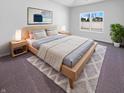 Inviting main bedroom with a comfortable bed, soft lighting, and a window overlooking the peaceful neighborhood at 6812 W Wintergreen Ct, McCordsville, IN 46055