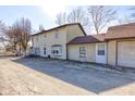 A lovely rear exterior view, showing the ample parking and access to the garage at 724 E 199Th St, Westfield, IN 46074