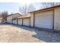 Wide angle shot of the side exterior featuring three garage doors and multiple entrances at 724 E 199Th St, Westfield, IN 46074