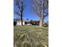 Lovely single-story brick home featuring an attached garage and a neatly kept front lawn at 7632 S Sherman Dr, Indianapolis, IN 46237