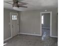 Open living room featuring neutral paint, carpet, and new front door at 101 N Gladstone Ave, Columbus, IN 47201