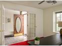 Open entryway featuring a decorative glass front door, tile flooring, and French doors at 12512 Geist Cove Dr, Indianapolis, IN 46236