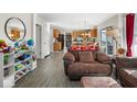 Open-concept living area showcasing a seamless transition to the kitchen and lots of natural light at 13812 Barnett Pl, Fishers, IN 46038