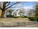Charming home featuring white siding, green shutters, and a well-manicured lawn at 147 Eastern Ave, Plainfield, IN 46168