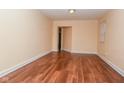 View of an empty living room with hardwood floors and natural light at 1937 N Lasalle St, Indianapolis, IN 46218