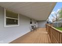 Inviting covered porch with seating, providing an ideal space for relaxation and outdoor enjoyment at 2230 Mindy Ct, Anderson, IN 46017
