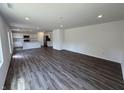 Spacious open concept living room featuring modern flooring, ample natural light, and open access to the kitchen at 3328 Stafford St, Sheridan, IN 46069