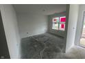 Bright living room with large window, offering a view and filling the space with natural light at 3328 Stafford St, Sheridan, IN 46069