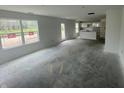 Spacious living room with ample natural light and an open layout to the kitchen at 3328 Stafford St, Sheridan, IN 46069