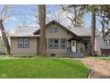 Charming home with a well-maintained lawn, landscaped yard, and traditional architecture at 3750 Totem Ln, Indianapolis, IN 46208