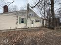 Home exterior featuring a brick chimney, and back deck at 4534 N State Road 9, Anderson, IN 46012