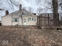 Back exterior of home featuring a brick chimney and deck at 4534 N State Road 9, Anderson, IN 46012