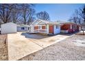 Home exterior with spacious driveway leading to the detached garage in rear at 493 N Avon Ave, Avon, IN 46123