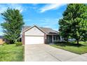 Attractive single-Gathering home with a two-car garage, set on a well-maintained lawn with mature trees at 5772 Jamestown Square Ln, Indianapolis, IN 46234