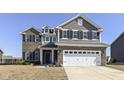 Charming two-story house featuring a two-car garage and inviting curb appeal at 6199 N Caraway Dr, McCordsville, IN 46055