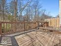 Large wooden deck offers plenty of space for outdoor entertaining with wood railings and gate feature at 6263 Behner Way, Indianapolis, IN 46250