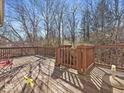 Large wooden deck offers plenty of space for outdoor entertaining with wood railings and gate feature at 6263 Behner Way, Indianapolis, IN 46250